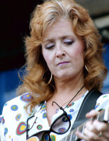 Bonnie Raitt performs in August 1987 at the Newport Folk Festival in Newport, Rhode Island.