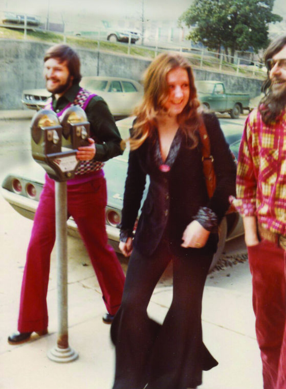 Bonnie Raitt responds to a grand reception at the Record Bar in Chapel Hill in 1973- A group of musicians set up their instruments in the bed of a pickup and performed Spider John Koerner song, “Takin’ My Time" as Raitt walked up to the store.