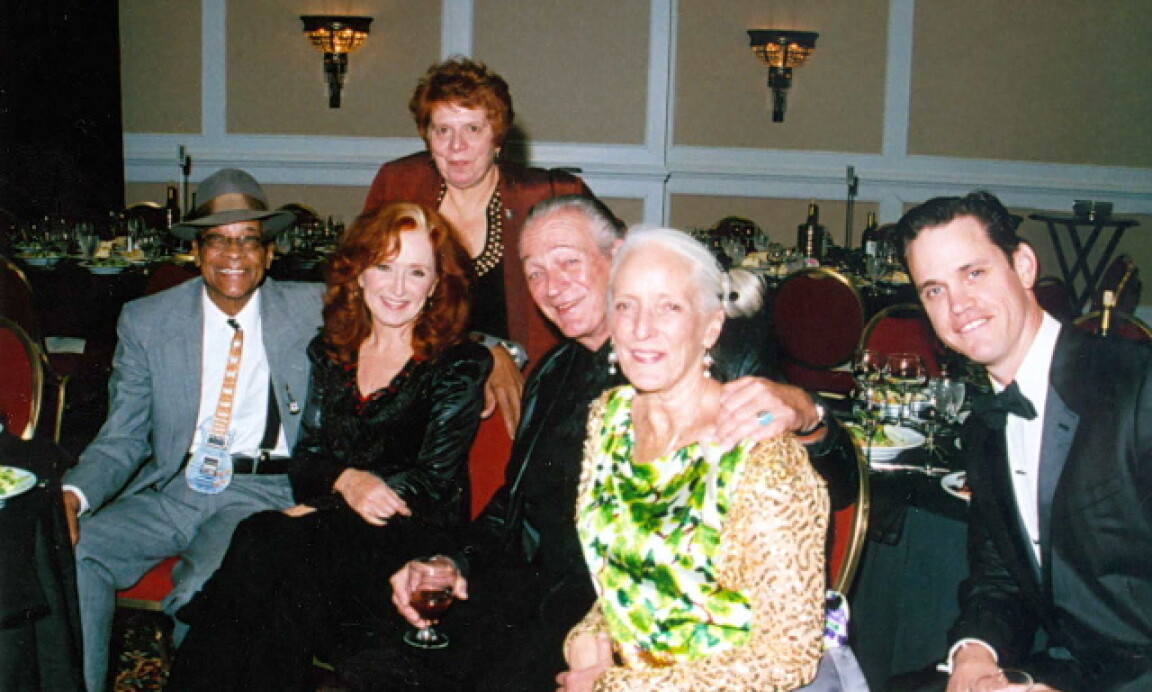 Blues superstars Charlie Musselwhite (third from right) and Bonnie Raitt visit with friends Wednesday in the Marriott Hotel's grand ballroom before their induction into the Blues Hall of Fame in Memphis. Pictured with them are (from left) legendary bluesman Hubert Sumlin; Judy Peiser (standing), director of the Southern Folklore Center in Memphis; Henrietta Musselwhite; and California filmmaker Robert Anderson. Blues Foundation, Marriott Hotel, Memphis 5-5-2010