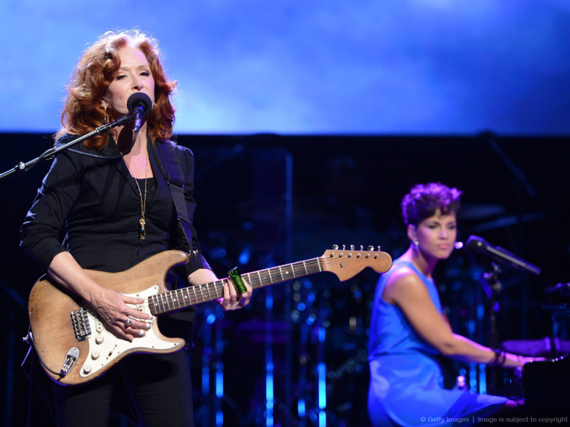 Bonnie Raitt and Alicia Keys perform on stage during Black Ball Redux at The Apollo Theater on December 6, 2012 in New York City.