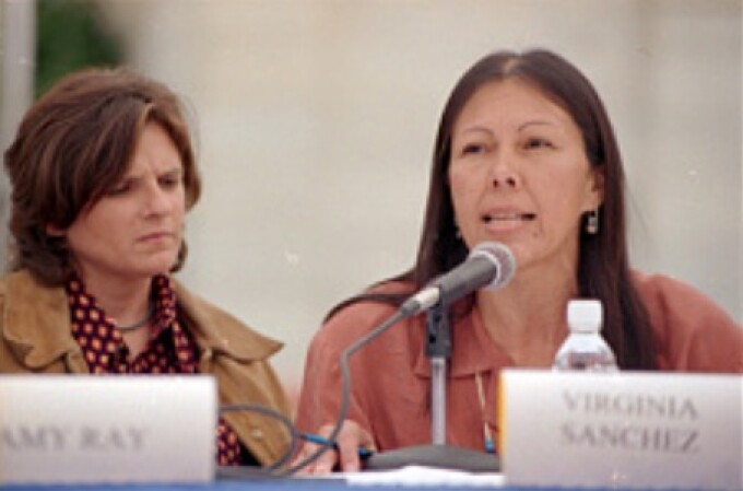 Virginia Sanchez, right, of Honor the Earth, sponsor of a 21-concert tour of the Indigo Girls, and Indigo Girl Amy Ray at a press conference on the west terrace of the Capitol in opposition to H.R. 1270, the Nuclear Waste Policy Act of 1997, which would allow for the transfer of radioactive waste to Yucca Mountain, Nevada. Nevada Democratic Sens. Harry Reid and Richard Bryan also attended. 24 Sept. 1997