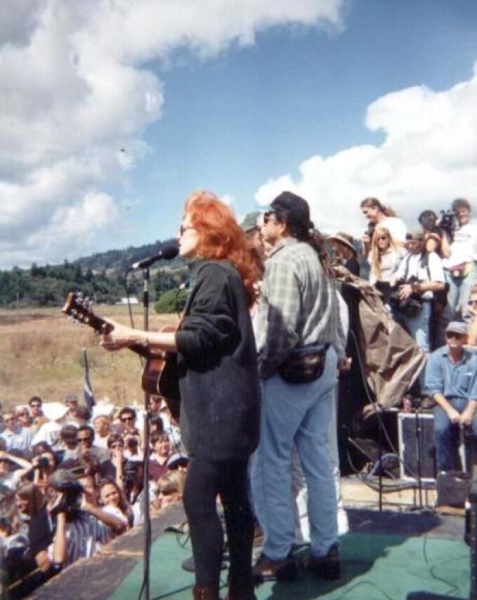 Grammy award-winning blues musician Bonnie Raitt sings during a demonstration over the situation in the Headwaters Forest in front of the Pacific Lumber Company mill in Carlotta, Calif., Sunday Sept. 15, 1996. Environmentalists are upset at the company's plans to salvage logging in an ancient 3,000 acres of the Headwaters Forest.